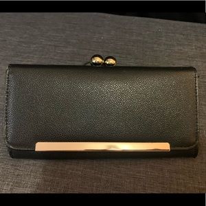 Black wallet with gold accents
